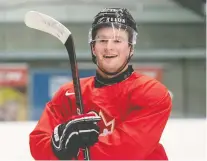  ?? RYAN REMIORZ/ THE CANADIAN PRESS FILES ?? Alexis Lafreniere was all smiles at the world juniors a year ago in the Czech Republic, but he won't be playing for Canada this time around in Edmonton and Red Deer.