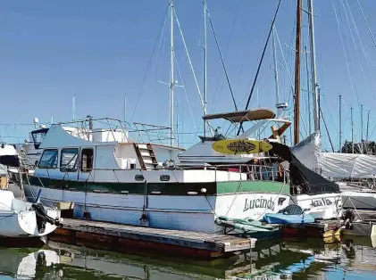  ?? Courtesy/Kristen Hamilton ?? Author Kristen Hamilton’s boat Lucinda, where she lives, in its slip on a sunny day in Marin County.
