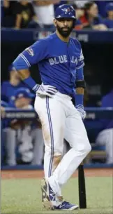  ?? PHOTOS BY CARLOS OSORIO, TORONTO STAR ?? Is this the last we’ll see of them? Edwin Encarnacio­n, left, and Joe Bautista may have seen their final at-bats with the Toronto Blue Jays in Wednesday’s Game 5 loss in the ALCS to the Cleveland Indians.