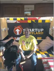  ?? STAFF PHOTO BY CHARLIE WRIGHT ?? Founder and CEO of Startup Maryland Michael Binko sits at the back of the Startup Maryland bus, the site of many business pitches delivered by hopeful entreprene­urs.