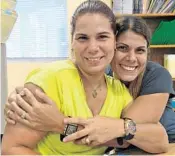  ??  ?? Glorymar Olmeda, right, and her sister Heyda Calderon. Calderon has enrolled her children in school in Palm Beach County after relocating from Puerto Rico.