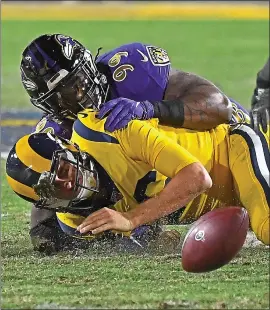  ?? JAYNE KAMIN-ONCEA — GETTY IMAGES ?? The Ravens’ Matt Judon (99) sacks Rams quarterbac­k Jared Goff and forces a fumble in the first half of Monday’s game at the Los Angeles Memorial Coliseum.