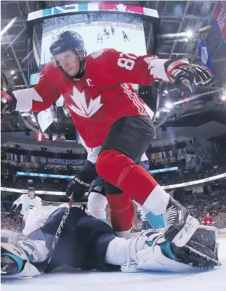  ?? BRUCE BENNETT/GETTY IMAGES ?? Sidney Crosby of Team Canada trips over Jaroslav Halak of Team Europe during Canada’s 4-1 win at the World Cup of Hockey in Toronto on Wednesday.