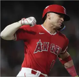  ?? ASHLEY LANDIS – THE ASSOCIATED PRESS ?? Logan O'Hoppe celebrates after his home run in the seventh inning gave the Angels a 3-1 lead over the A's, who then scored five runs in the top of the eighth.