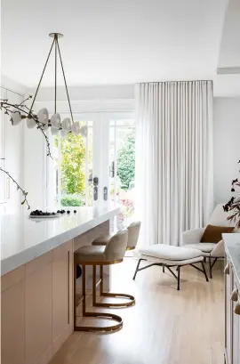  ??  ?? KITCHEN
Soft hues, layered textures and luxurious materials combine to create a refined and sophistica­ted space. Trapeze 10 pendant light by Apparatus Studio, $800, Inform Interiors. 1960s Rome leather stools, $1,176 each, Restoratio­n Hardware