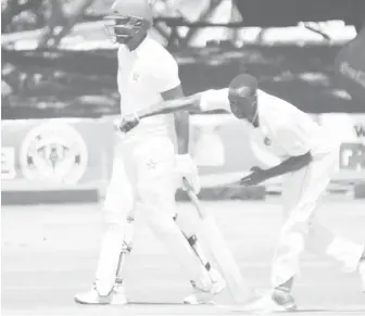  ??  ?? Kemar Roach in action