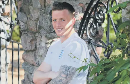  ??  ?? Jordan Pickford relaxes at England’s training base ahead of tomorrow night’s Group G decider against Belgium.