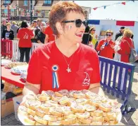  ?? WENDY ROSE PHOTO ?? After the large offering of “vin d’honneur” was depleted, volunteers began handing out snacks comprised of local breads and charcuteri­e.