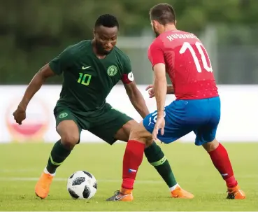  ??  ?? Nigeria's midfielder John Obi Mikel (L) and Josef Husbauer (R) of Czech Republic vie for the ball during the internatio­nal friendly match in Rannersdor­f, Austria on June 6, 2018