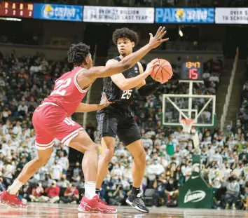  ?? REY DEL RIO/GETTY ?? Malik Hall of Michigan State handles the ball under pressure from Jordan Geronimo of Indiana in the first half on Saturday.