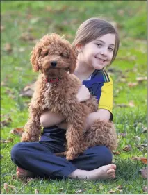  ?? Picture: PAUL CARRACHER ?? SPECIAL: Phoebe Parish, 5, enjoys time with her dog, Archie.