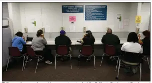  ?? (AP) ?? Visitors use the unemployme­nt insurance phone bank at the California Employment Developmen­t Department office in Sacramento in this September photo. Two Senate Democrats on Wednesday announced a plan to overhaul the nation’s unemployme­nt insurance system.