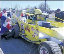  ??  ?? Track offi cials inspect a modifi ed 358 race car at Merrittvil­le Speedway’s Test and Tune Session Saturday.