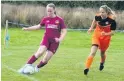  ??  ?? ● Erin Maloney (maroon) on the attack for Bethel