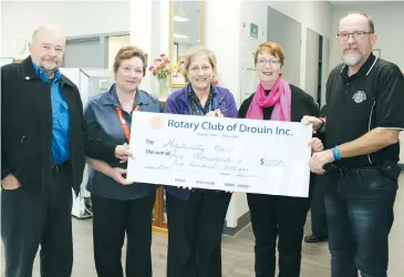  ??  ?? Rotary club members Ian Haughton left), Anita Coonan and Ian Bennett (right), present a cheque for $2500 to WGHG maternity unit staff members Wilma Wallace (left) and Beck Heine.