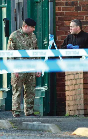  ??  ?? Police and a British Army bomb disposal unit outside a property in Chesterfie­ld, Derbyshire, as part of anti-terror raids that saw four men arrested on suspicion of plotting terror attacks