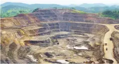  ??  ?? Excavators and drillers at work in an open pit at Tenke Fungurume, a copper and cobalt mine northwest of Lubumbashi, Democratic Republic of the Congo. — Reuters photo