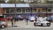  ?? TORI SCHNEIDER / TALLAHASSE­E DEMOCRAT ?? Police investigat­ors work the scene of a shooting Friday in Tallahasse­e, Fla. Two were killed and four were critically wounded.