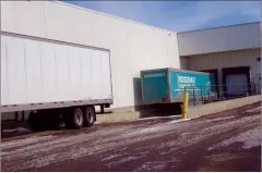 ?? NEWS PHOTO GILLIAN SLADE ?? A Rosenau trailer is being unloaded at a local grocery store. Allowing truck drivers to transport goods over the U.S. border without having to self-isolate unless they are sick is crucial to ensuring there are enough supplies available.