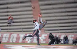  ?? ROBERTO ROSALES/JOURNAL ?? UNM’s Delane Hart-Johnson, right, leaps in the end zone for a catch while being covered by San Diego State’s Darren Hall in a less-than-full Dreamstyle Stadium.