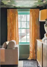  ?? J. Savage Gibson ?? Lush green lily pads cover the ceiling of Denise Mcgaha’s room for the Savannah SouthernSt­yle Now show house. She teamed the greens (also the wall color) with peach draperies. Both are part of her new collection for Design Legacy.