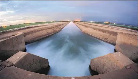  ?? Don Bartletti Los Angeles Times ?? IRRIGATION WATER on its way to farms in Brawley, Calif. The San Diego County Water Authority buys some of the Imperial Irrigation District’s share of Colorado River water in order to decrease its dependence on the Metropolit­an Water District of...