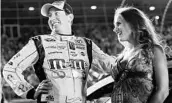  ?? JARED C. TILTON/GETTY IMAGES ?? Although often cantankero­us, Kyle Busch has reason to smile with wife Samantha considerin­g his track success.