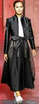  ??  ?? Cropped tailored gazar jacket and sheer tulle skirt