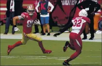  ?? TONY AVELAR — THE ASSOCIATED PRESS, FILE ?? The 49ers’ George Kittle (85) runs against Cardinals strong safety Budda Baker (32) during the first half in Santa Clara on Sunday.