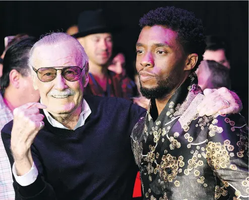  ?? CHRIS PIZZELLO/THE ASSOCIATED PRESS ?? Stan Lee, left, with Black Panther star Chadwick Boseman, at its opening in January.