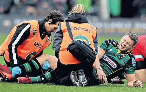  ??  ?? Injury fear: Northampto­n fly-half Dan Biggar limped off with a knee strain