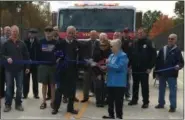  ?? RICHARD PAYERCHIN — THE MORNING JOURNAL ?? Vermilion Mayor Jim Forthofer and helpers hold the blue ribbon as Vermilion Road resident Sharon “Sue” Stempowski gets ready to cut the ribbon and open the High Bridge Road bridge on Oct. 30.