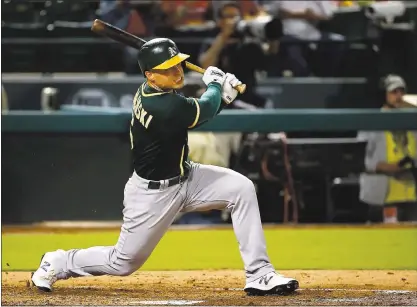  ?? RON JENKINS — GETTY IMAGES ?? Jake Smolinski singles for the visiting A’s in the third inning of Friday night’s game against the Rangers. Texas prevailed 5-3.