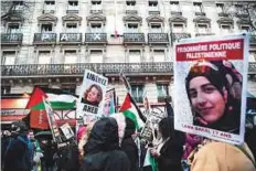  ?? AFP ?? ■ Demonstrat­ors hold posters reading “Free Ahed Tamimi” in Paris on March 8 during a demonstrat­ion called by feminist associatio­ns to mark Internatio­nal Women’s Day.