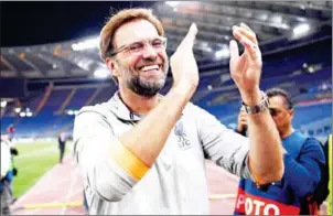  ?? AFP ?? Liverpool manager Jurgen Klopp applauds the fans following their Champions League semifinal second-leg victory over Roma on Wednesday night.