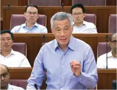  ??  ?? SINGAPORE: Singapore’s Prime Minister Lee Hsien Loong delivers a speech in Parliament yesterday in Singapore. Prime Minister Lee has addressed his escalating family feud in a speech in Parliament, saying his siblings’ accusation­s that he had misused...