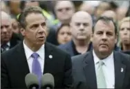  ?? THE ASSOCIATED PRESS ?? New York Gov. Andrew Cuomo, left, speaks during a news conference Thursday on the train crash at the Hoboken Terminal as New Jersey Gov. Chris Christie, right, listens in Hoboken, N.J.