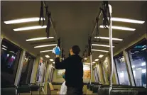  ?? DAI SUGANO —STAFF ARCHIVES ?? A BART utility worker uses disinfecti­ng wipes to sanitize the inside of a BART car on March 10 at the Warm Springs / South Fremont BART station in Fremont.