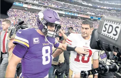  ?? HANNAH FOSLIEN — GETTY IMAGES, FILE ?? The Vikings’ Kirk Cousins (8) and the 49ers’ Jimmy Garoppolo (10) greet each other on the field after their 2018 game at U.S. Bank Stadium in Minneapoli­s. The Vikings defeated the 49ers 24-16.