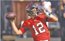  ?? AP PHOTO/MARK LOMOGLIO ?? Tampa Bay Buccaneers quarterbac­k Tom Brady warms up before last Sunday’s game against the Minnesota Vikings.