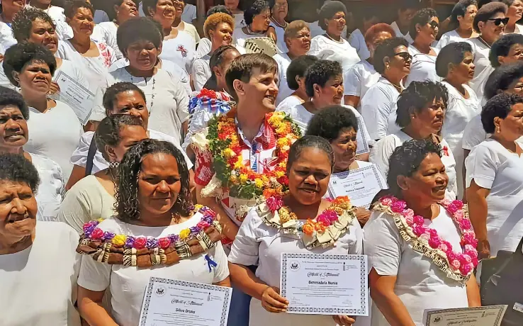  ?? ?? The United States of America Embassy (Suva) Deputy Public Affairs Officer, Will Romine with participan­ts of the Soqosoqo Vakamarama Itaukei Cakaudrove (SVTC) Entreprene­urship Skills training after their graduation ceremony in Savusavu on November 23, 2022 .