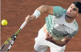  ?? Photo / AP ?? Spain’s Carlos Alcaraz delivers a power serve.