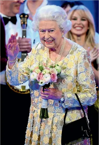  ?? PHOTO: AP ?? Queen Elizabeth II waves on stage at the Royal Albert Hall in London after a concert to celebrate her 92nd birthday.