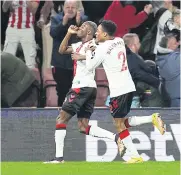  ?? REUTERS ?? Southampto­n’s Moussa Djenepo, left, celebrates scoring their second goal with Kyle WalkerPete­rs.