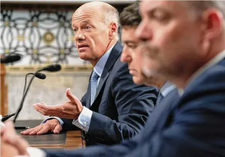  ?? Jacquelyn Martin/Associated Press ?? Gregory Becker, left, former CEO of Silicon Valley Bank, testifies during a Senate hearing. SVB’s failure was not unavoidabl­e.
