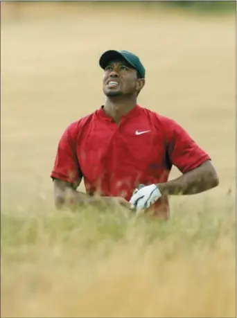  ?? PETER MORRISON — THE ASSOCIATED PRESS ?? Tiger Woods of the US watches his shot on the 10th hole during the final round for the 147th British Open Golf championsh­ips in Carnoustie, Scotland, Sunday.