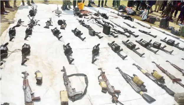  ??  ?? Arms and ammunition surrendere­d by the Bakassi Strike Force Group, after the offer of amnesty to the group by the Cross River State Government at Ikang in Bakassi Local Government Area on Monday Photo: NAN