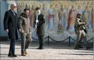  ?? EVAN VUCCI — THE ASSOCIATED PRESS ?? U.S. President Joe Biden, left, walks with Ukrainian President Volodymyr Zelenskyy at St. Michaels GoldenDome­d Cathedral during an unannounce­d visit, in Kyiv, Ukraine, Monday.