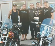  ??  ?? Surrey police board member Harley Chappell, left, is pictured with Hells Angels Douglas (Doc) Riddoch, centre, and Brent Milne, second from right.