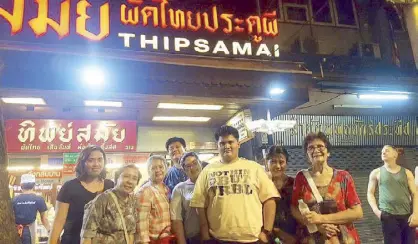  ??  ?? Hungry food trippers pose outside Thipsamai restaurant (from left): Lorraine Pascasio and Leah Tadena; Joy, Richard, Jori, Doods, Amy and Otilia Pamintuan.